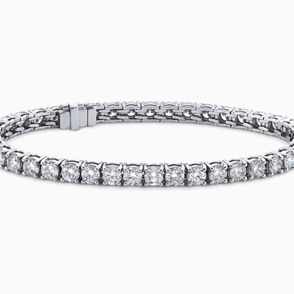 A (Blue Nile Signature Ideal Cut Diamond Tennis Bracelet)..
